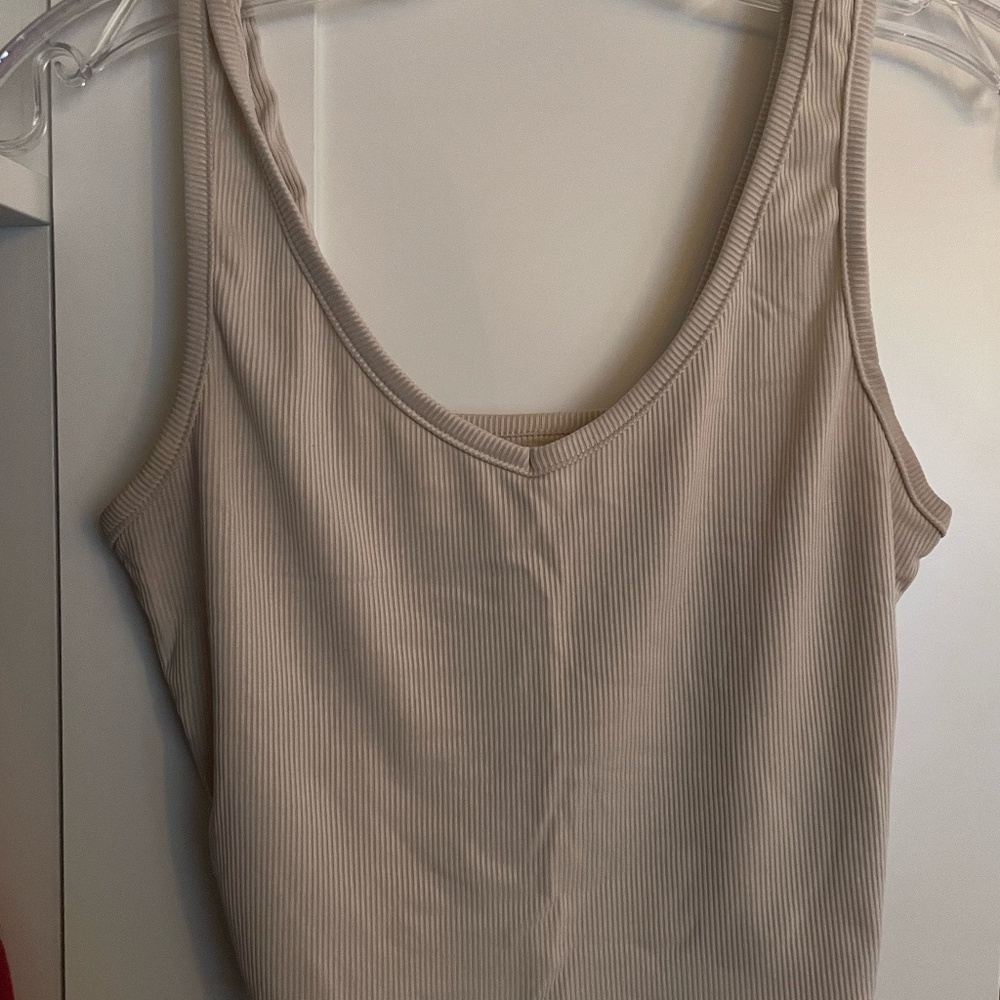 2 tank tops - cream and blue colored